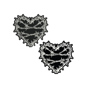 The Barbed Wire Heart Pasties Reflective Nipple Covers by Pastease®. Two black hearts with silver reflective barbed wire patterned shaped nipple covers shown on a white background. Perfect for festivals, pride, burlesque, raves, only fans content or parties.