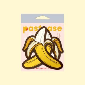 The Banana Pasties Long Yellow Nipple Covers by Pastease®. Two bananas being peeled open nipple covers in the pastease pastel packaging on a pastel yellow background. Perfect for a festival, burlesque performance, drag shows, pride or parties.