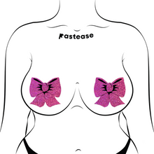Load image into Gallery viewer, Glittering Hot Pink Bow Nipple Pasties by Pastease®. Two bright pink sparkly big bow shaped nipple covers shown on a femme body outline for size reference on a white background.
