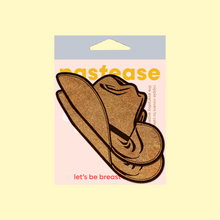 Load image into Gallery viewer, The Wild West Brown Suede Cowboy Hat Nipple Pasties Stylish Nipple Covers by Pastease®. Two suede brown cowboy hat shaped nipple covers in the pastease pastel packaging on a pastel yellow background. Perfect for a festival, burlesque performance, pride or parties.
