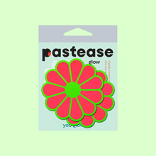 Load image into Gallery viewer, The Daisy: Neon Green &amp; Glow in the Dark Neon Pink Petal Pasties Nipple Covers by Pastease®. Two neon coral pink with green outlines coloured flower shaped nipple covers in pastease pastel packaging on a light green background. Perfect for a festival, burlesque performance, pride or parties.
