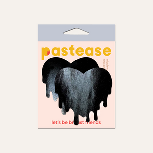 Melty Heart: Faux Latex Pleather Vinyl Black Melty Heart Nipple Pasties by Pastease®. Two shiny black drippy heart shaped nipple covers shown in the pastease packaging on a cream background.
