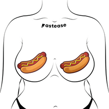 Load image into Gallery viewer, The Hotdog Pasties Weiner with Mustard Nipple Covers by Pastease®. Two hot dog sausages in long buns with mustard drizzled across in a zig zag pattern nipple covers shown on a femme body outline on a white background. Perfect for a festival, burlesque performance, drag shows, pride or parties.
