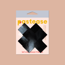 Load image into Gallery viewer, Plus X: Faux Latex Pleather Vinyl Black Cross Nipple Pasties by Pastease. Two shiny black cross shaped nipple covers shown in the pastease packaging on a light brown background.
