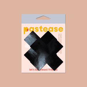 Plus X: Faux Latex Pleather Vinyl Black Cross Nipple Pasties by Pastease. Two shiny black cross shaped nipple covers shown in the pastease packaging on a light brown background.