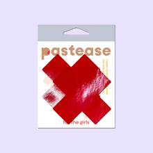 Load image into Gallery viewer, Plus X: Faux Latex Pleather Vinyl Red Cross Nipple Pasties by Pastease®. Two shiny red cross shaped nipple covers shown in the pastease packaging on a lilac background.
