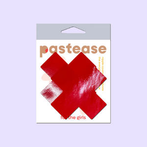 Plus X: Faux Latex Pleather Vinyl Red Cross Nipple Pasties by Pastease®. Two shiny red cross shaped nipple covers shown in the pastease packaging on a lilac background.