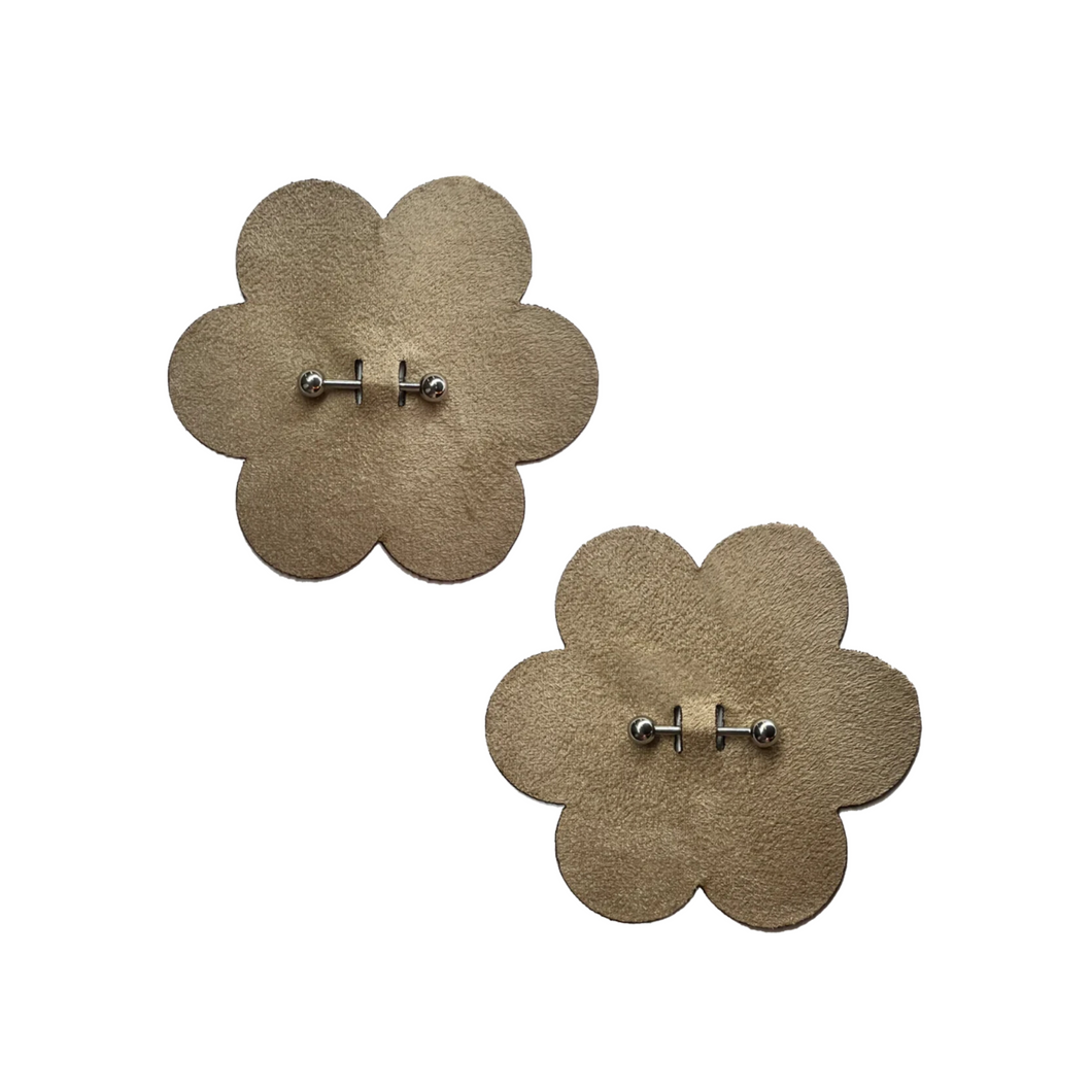 The Pierced Pasties: Nude Flower Breast Petal with Barbell Piercing Nipple Covers by Pastease®. Two nude warm beige flowers with silver barbell piercings through the middle nipple covers on a white background. Perfect for a festival, burlesque performance, pride or parties.