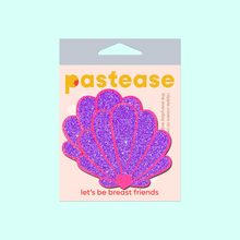 Load image into Gallery viewer, The Mermaid Shell Pasties in Neon Pink &amp; Purple Glitter Seashell Nipple Covers by Pastease®. Two neon pink and purple glitter sea shells in pastel pastease packaging on a mint blue background. Perfect for a festival, pride, burlesque performance, only fans content or a party.
