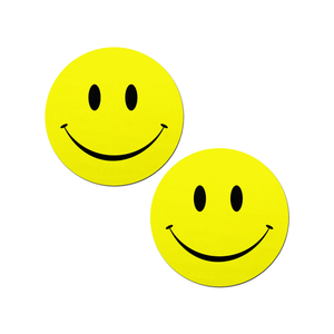 Smiley Faces: Bright Yellow Nipple Pasties by Pastease®. Two yellow smiley face nipple covers, shown on white background. Perfect for a festival, burlesque performance, pride or parties.