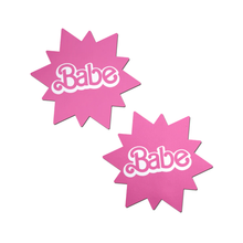 Load image into Gallery viewer, Babe Doll Pink Sunburst Pasties by Pastease®. Two barbie pink coloured sunburst star nipple covers with babe written in the centre shown on a white background. Perfect for festivals, pride, burlesque, raves, only fans content or parties.
