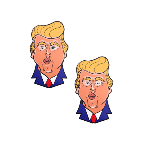 The Donald J Trump Pasties DJT Nipple Covers by Pastease on a white background. Two nipple covers of donald j trump busts in a cartoon style with his orange tan, yellow blonde hair and blue suit with red tie, he is puckering his lips for a kiss. Perfect for a festival, burlesque performance, drag shows, pride or parties.