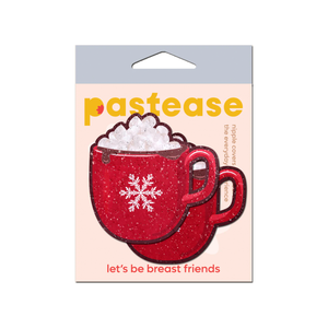 Hot Cocoa Pasties Hot Chocolate Nipple Covers by Pastease®. Two red glittery mug shaped nipple covers with white snowflake on the front of the mug and marshmallows on top. Shown in their packet on a white background.