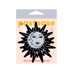 Sunburst: Sun & Moon Faces on Silver Glitter Sun Nipple Pasties by Pastease®. Two glittery silver and black nipple covers in the shape of a sun and moon, shown on a white background. Perfect for a festival, burlesque performance, pride or parties.