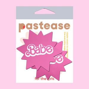 Babe Doll Pink Sunburst Pasties by Pastease®. Two barbie pink coloured sunburst star nipple covers with babe written in the centre shown in the pastease packaging on a baby pink background.