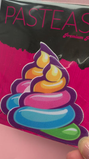 Video of the Unicorn Poo: Scummy Bear Rainbow Shit Emoji Nipple Pasties by Pastease in the Pastease pink and black packaging.