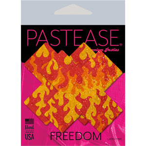Plus X: Flaming Sparkle Cross Nipple Pasties by Pastease® o/s in the pastease pink and black packaging. Perfect for a festival, pride, burlesque performance, only fans content or a party.
