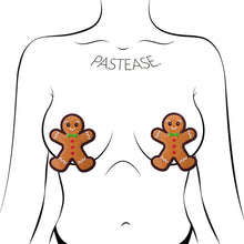 Load image into Gallery viewer, Gingerbread Man Woman Christmas Holiday Nipple Pasties by Pastease shown on a femme body outline for size reference on a white background.
