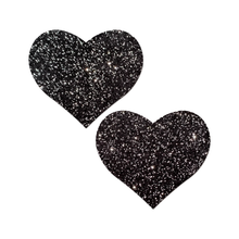 Load image into Gallery viewer, Love: Sparkle Velvet Heart Pasties by Pastease® o/s. Two glittery black heart shaped nipple covers on a white background. Perfect for a festival, pride, burlesque performance, only fans content or a party.
