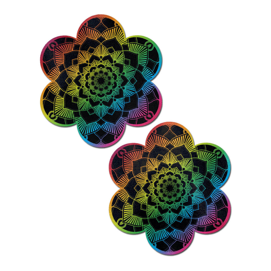 Daisy: rainbow mandala flower nipple pasties by pastease. Multicoloured rainbow base fabric with intricate black mandala detailing printed over. Perfect for a festival, pride, burlesque performance, only fans content or a party.