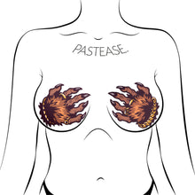 Load image into Gallery viewer, Monster Hands Pasties: Classy Werewolf Claws Nipple Covers by Pastease®. Two brown monster hands with long claws and gold jewellery in a clasped shape nipple covers shown on a femme body outline for size reference on a white background.
