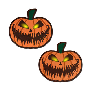 Pumpkin: Terrifying Halloween Jack O' Lantern Nipple Pasties by Pastease® o/s. Two spooky orange pumpkin jack o' lanterns on a white background. Perfect for a festival, pride, burlesque performance, only fans content or a party.