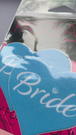 Video of the Love: Blue 'Bride' Heart Nipple Pasties by Pastease in the pink and black pastease packaging.
