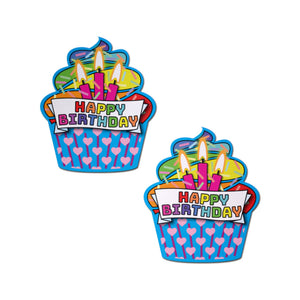Cupcake: Turquoise & Multi-Color Happy Birthday Nipple Pasties by Pastease. Two rainbow happy birthday cupcakes with candles and hearts nipple covers on a white background. Perfect for a festival, pride, burlesque performance, only fans content or a party.