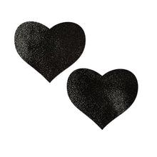 Load image into Gallery viewer, Love: Liquid Heart Nipple Pasties by Pastease. Black shiny heart shaped nipple covers on a white background. Perfect for a festival, pride, burlesque performance, only fans content or a party.
