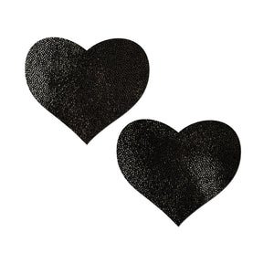 Love: Liquid Heart Nipple Pasties by Pastease. Black shiny heart shaped nipple covers on a white background. Perfect for a festival, pride, burlesque performance, only fans content or a party.