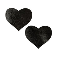 Love: Liquid Heart Nipple Pasties by Pastease. Black shiny heart shaped nipple covers on a white background. Perfect for a festival, pride, burlesque performance, only fans content or a party.