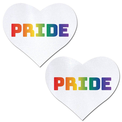Love: Rainbow 'PRIDE' on White Heart Nipple Pasties by Pastease. Two white hearts with rainbow pride text nipple covers on a white background. Perfect for a festival, pride, burlesque performance, only fans content or a party.