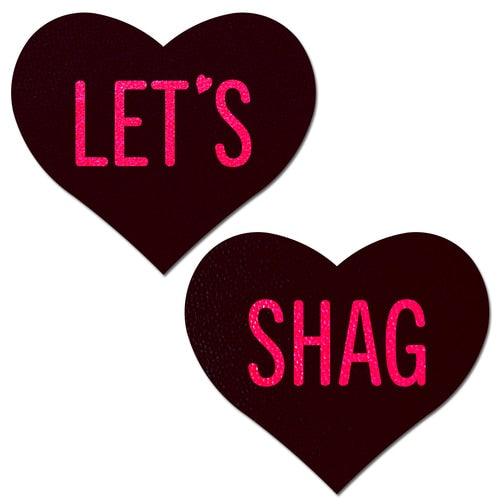 Love: Black Heart with Pink 'Let's Shag' Nipple Pasties by Pastease. Two black hearts that say let's shag in pink text nipple covers on a white background. Perfect for a festival, pride, burlesque performance, only fans content or a party.