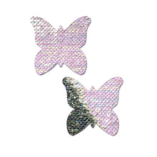 Load image into Gallery viewer, Monarch: J. Valentine® Pearl to Silver Flip Sequin Butterfly Nipple Pasties by Pastease®. Two pastel pearl pink and silver holographic sequin monarch butterfly nipple covers on a white background. Perfect for a festival, pride, burlesque performance, only fans content or a party.
