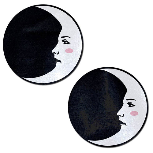 Moon: Black and White Man in the Moon Nipple Pasties by Pastease. Two crescent moon with pink blush on black circle nipple covers on a white background. Perfect for a festival, pride, burlesque performance, only fans content or a party.