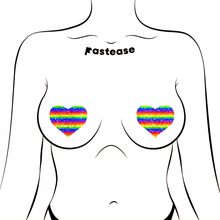 Load image into Gallery viewer, Love: Glittering Double Rainbow Heart Pasties by Pastease. Two glittery rainbow heart shaped nipple covers shown on a femme body outline on a white background.
