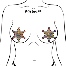 Load image into Gallery viewer, Sheriff Star: Glittering Golden Nipple Pasties by Pastease. Two glittery star shaped nipple covers with text reading sheriff in the centre similar to a cowboy badge shown on a femme body outline on a white background.
