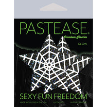 Load image into Gallery viewer, Star: Black Glitter Star with White Glow in the Dark Web Nipple Pasties by Pastease® o/s in the pastease glow black and green packaging. Perfect for a festival, pride, burlesque performance, only fans content or a party.
