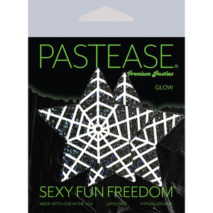 Star: Black Glitter Star with White Glow in the Dark Web Nipple Pasties by Pastease® o/s in the pastease glow black and green packaging. Perfect for a festival, pride, burlesque performance, only fans content or a party.